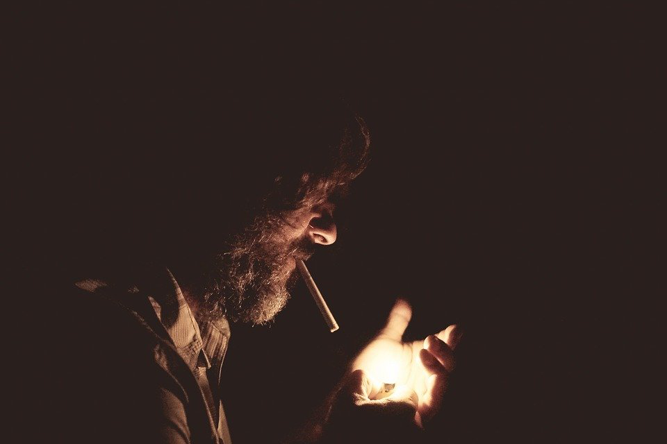 An Addict Lights Up A Cigarette